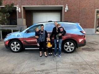 Family with a car